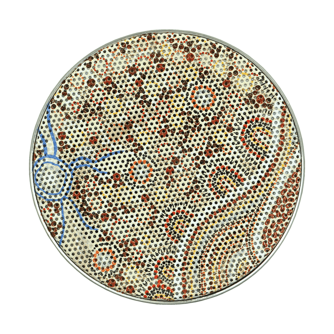 A circular decorative item featuring a complex dot painting design in earthy tones of red, brown, and cream, with blue accents.