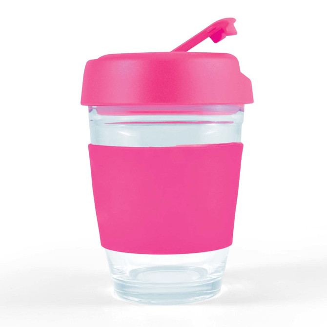 A reusable coffee cup with a clear body and a bright pink silicone sleeve and flip lid.