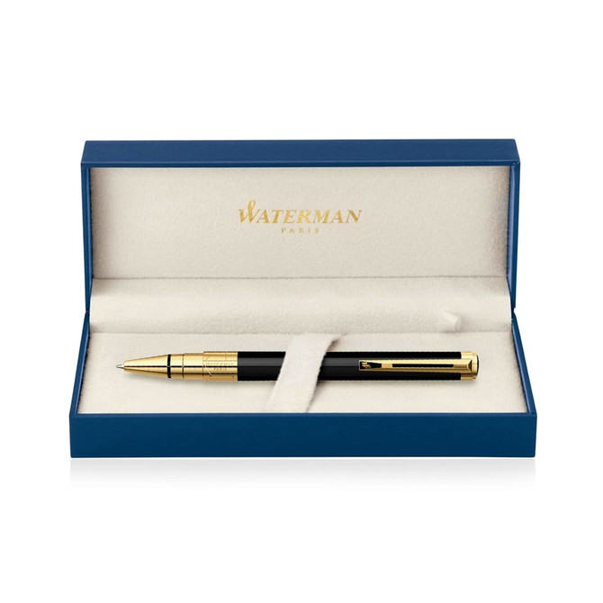 A black ballpoint pen presented in a blue and gold gift box, featuring a logo.
