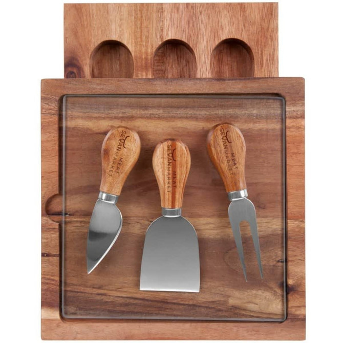 A wooden cheese board with a glass top and three wooden-handled cheese knives. The board features three knife slots.