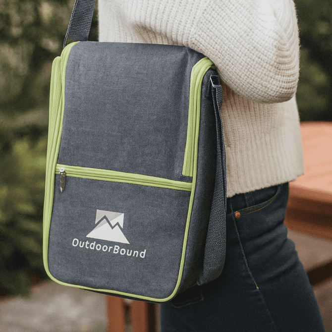 A grey bag with lime green accents and a logo, featuring a zippered front pocket and an adjustable strap.