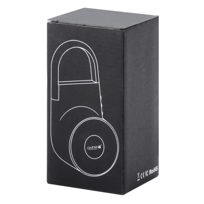 A black box containing a wireless speaker design with a round base and a handle. The box features a logo.