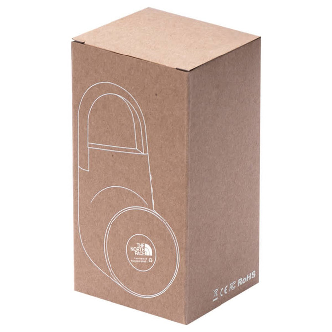 A brown cardboard box displaying a wireless speaker design with a logo, featuring a minimalistic style.