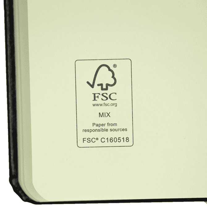 A bound journal with a black cover and cream-coloured pages, featuring an FSC certification logo.