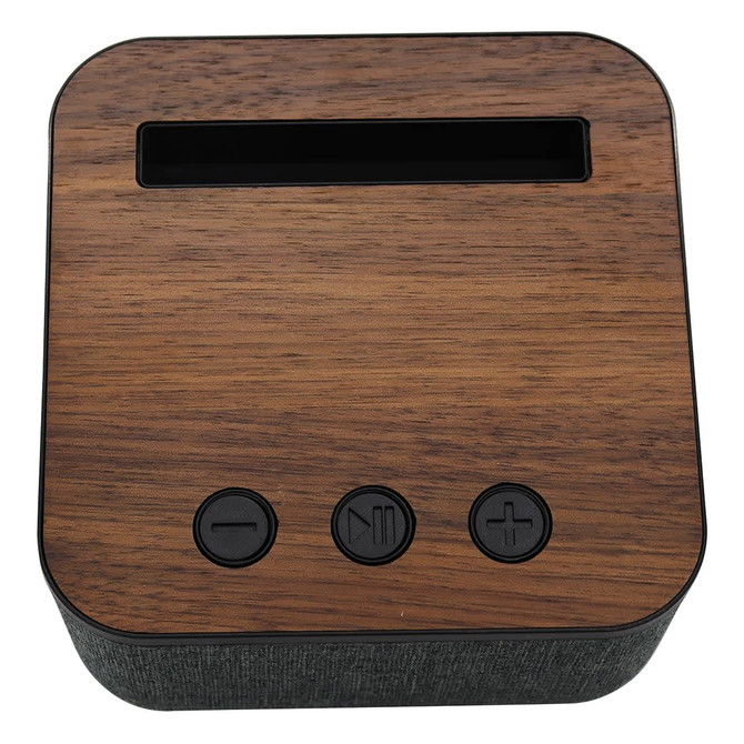 A square Bluetooth speaker featuring a wooden top and fabric-covered sides, with three control buttons on the front.