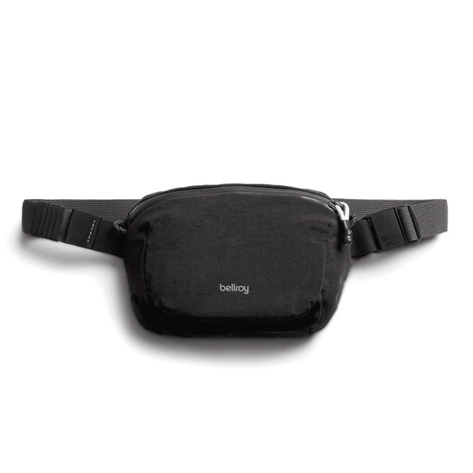 A black bum bag with a sleek design, featuring a logo and an adjustable strap.