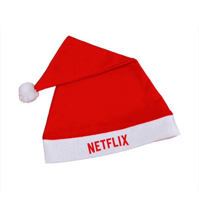 A red Santa hat with a white brim and a pom-pom, featuring a branding logo.