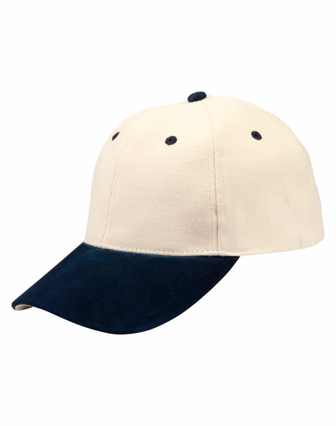 A suede peak cap in cream and navy, featuring a curved brim and ventilation holes. It includes a logo.