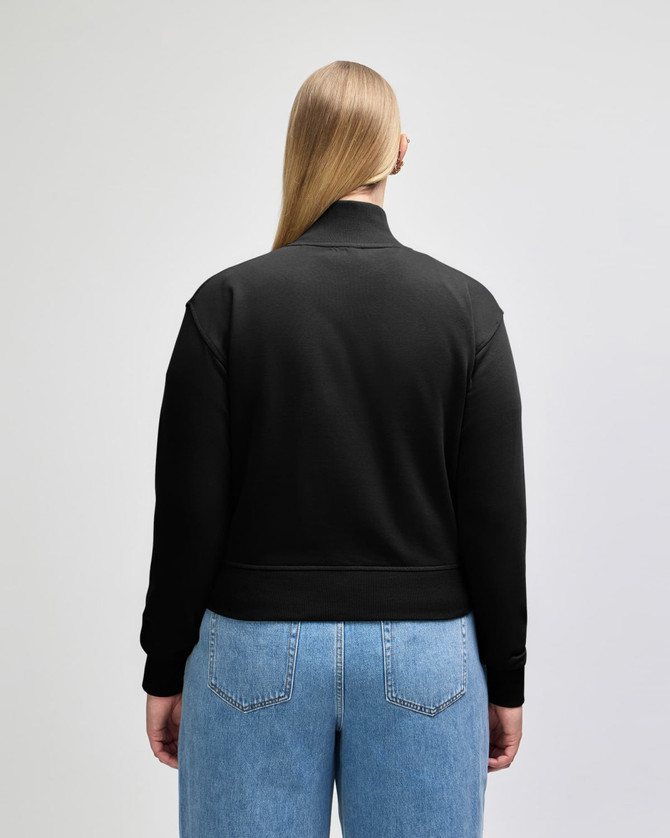 A black women's full-zip jacket made of French terry fabric, featuring a logo.
