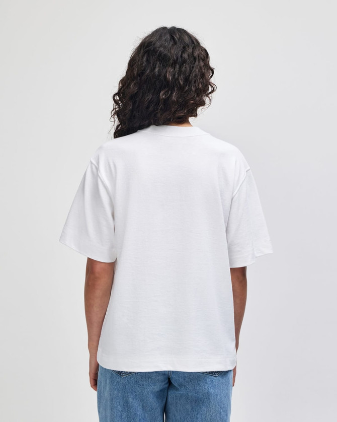 A white unisex boxy T-shirt made from heavyweight cotton, featuring short sleeves and a relaxed fit.