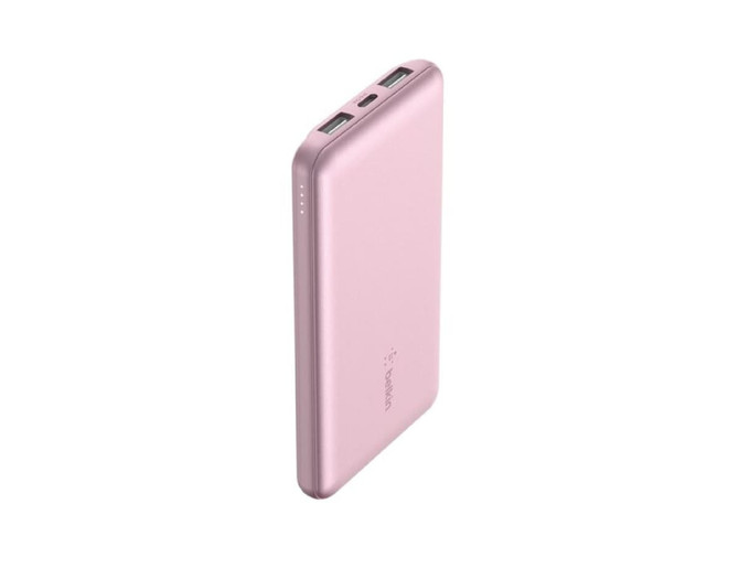 A pink power bank with two USB ports and a logo, featuring four indicator lights.