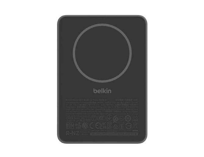 A slim black power bank with a circular magnetic charging area and a logo.