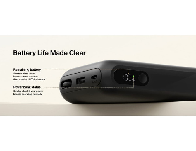 A black power bank with an integrated cable and digital display, showing battery life and power bank status.