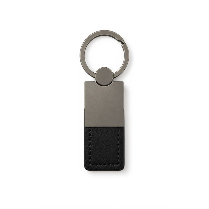 A sleek, black leather keytag with a metallic silver keyring attachment and minimalist design.