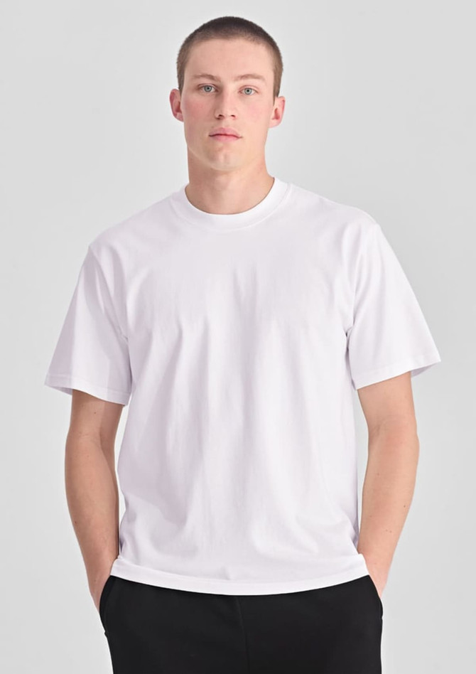 A white men's box tee with a relaxed fit, featuring short sleeves and a simple design.