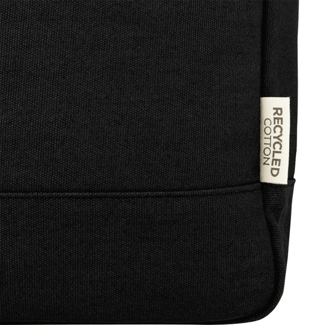 Black recycled canvas backpack tote with a label indicating material. Features sturdy construction and a simple design.