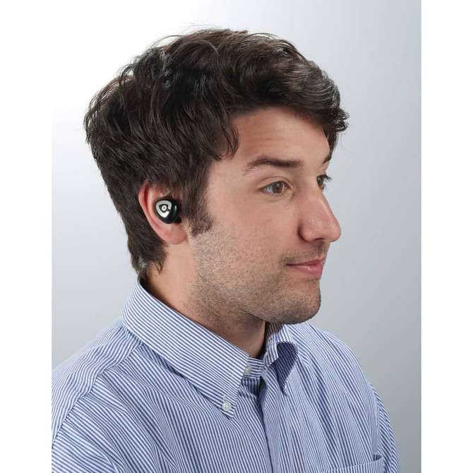 A man wearing black True Wireless Bluetooth earbuds, with a casual blue-striped shirt and a neutral background.