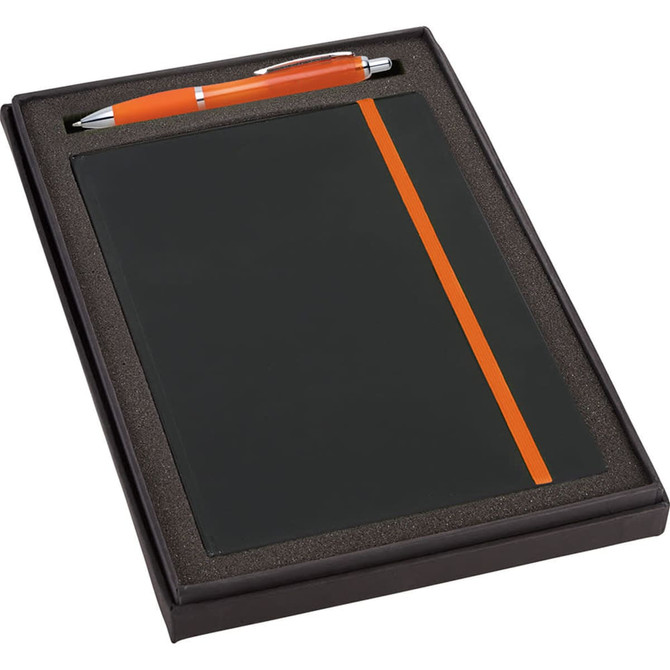 A black gift set featuring a JB1001 journal with an orange band and a matching orange pen, presented in a box.