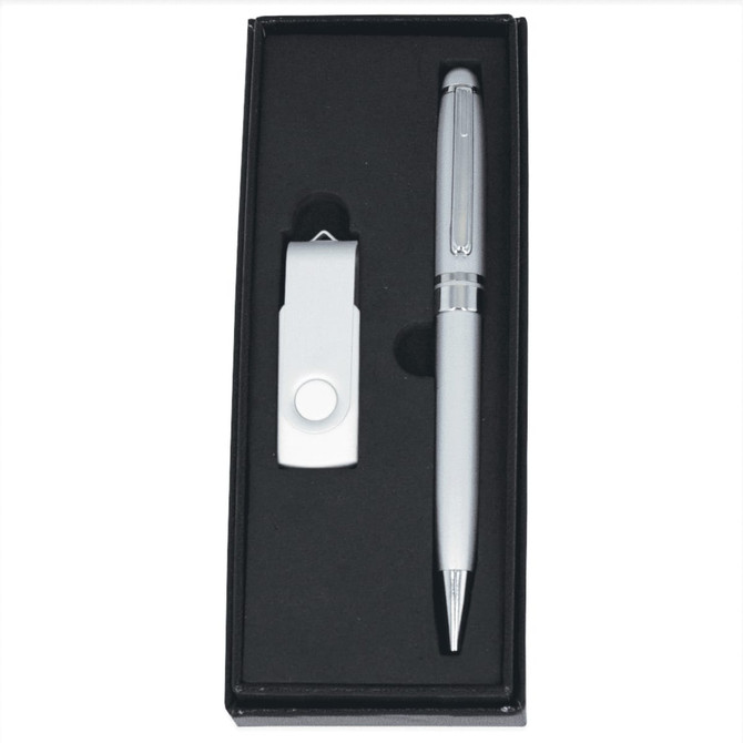 A silver USB flash drive and pen gift set in a black presentation box with a soft lining.