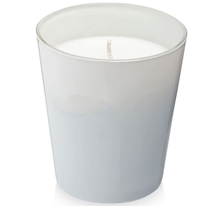 A grey glass candle holder with a white wax candle inside, featuring a single wick at the centre.