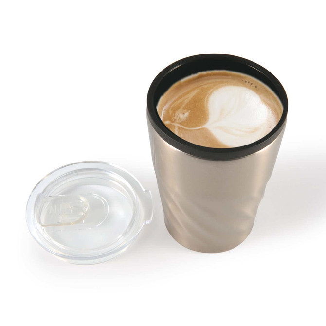 A reusable coffee cup in metallic silver with a black lid, containing a latte with a foamy design on top.