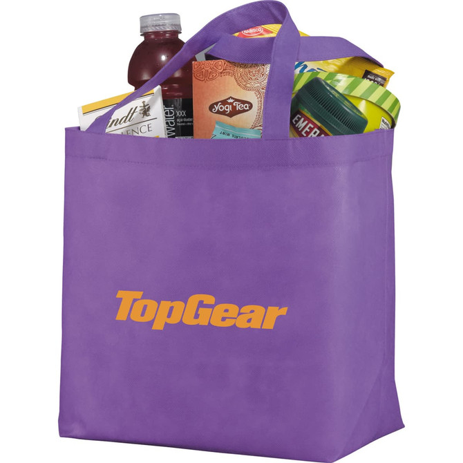 A purple non-woven tote bag filled with various products, featuring a logo on the front.