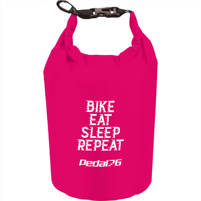 A pink waterproof outdoor bag with a black strap, featuring a logo and text: "Bike, Eat, Sleep, Repeat."