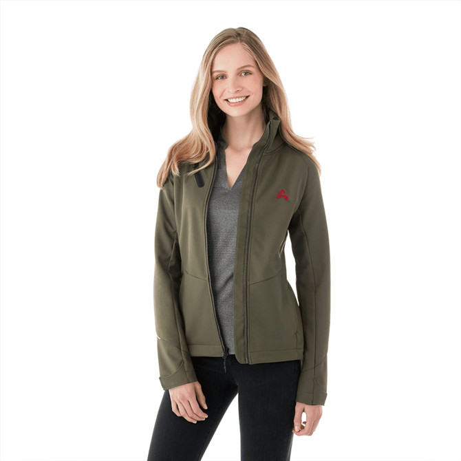A woman is wearing a green Peyto softshell jacket, featuring a logo on the chest. The jacket has a fitted design.