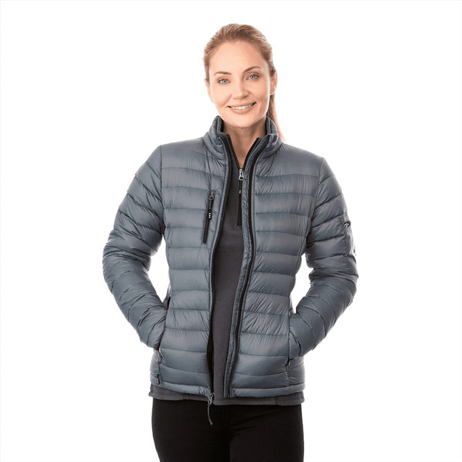 A women's puffer jacket in grey, featuring a zip front, stand-up collar, and a logo.