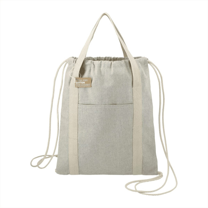 A light grey recycled cotton drawstring bag with a front pocket and dual handles. It features a logo on the label.