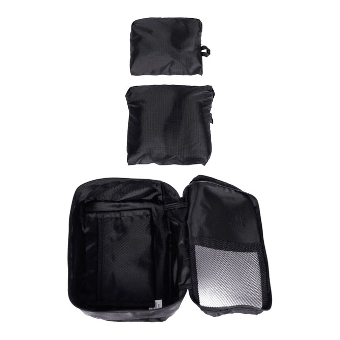 Three black packing cubes of varying sizes, with one open to reveal internal compartments, displaying a zippered design.