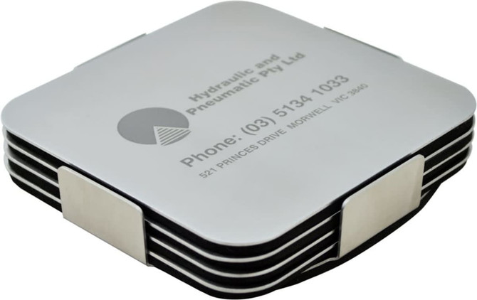 A set of silver coasters stacked together, featuring a sleek design with a logo and contact information.
