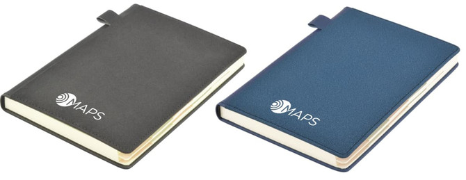 Two Tab Deluxe A5 Notebooks in grey and navy, featuring a logo on the cover. Both have a sleek design with a closure.