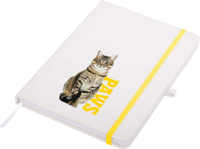 A white A5 notepad with a yellow elastic band, featuring a cat graphic and the word "PAWS".