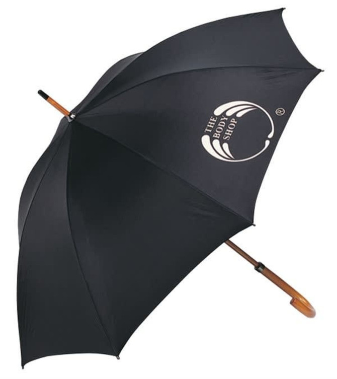 A black umbrella with a curved wooden handle and a logo on the canopy, designed for leisure and outdoors.