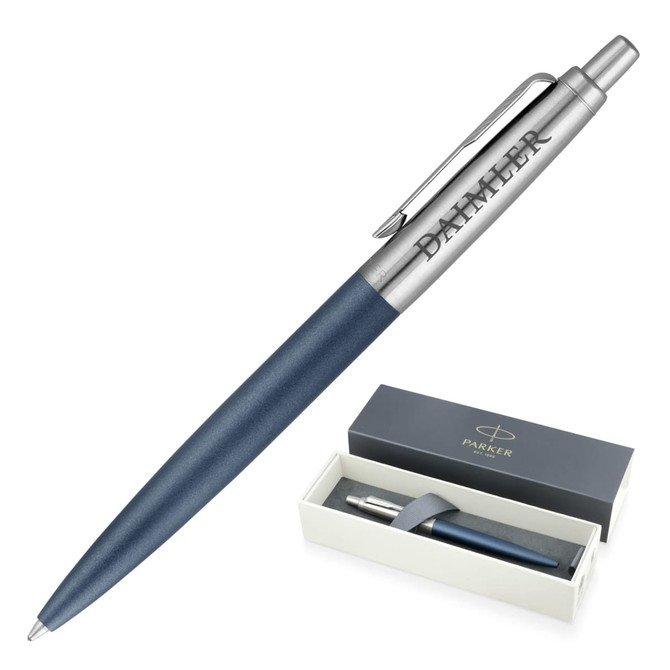 A metal ballpoint pen in matte blue with a silver clip and branding, presented in a two-tone gift box.