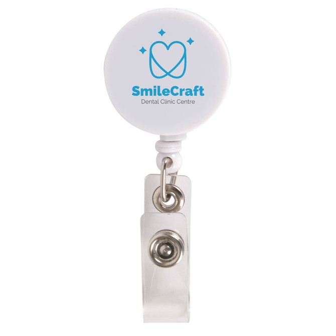 A white retractable name badge holder with a circular top and a metal clip, featuring a logo.
