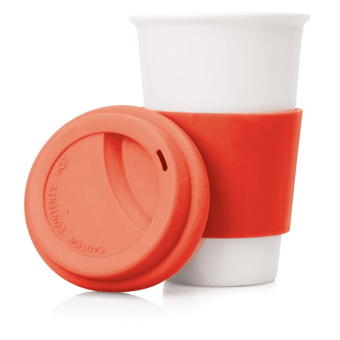 A drink bottle in white ceramic with an orange silicone sleeve and lid. It has a logo on the sleeve.