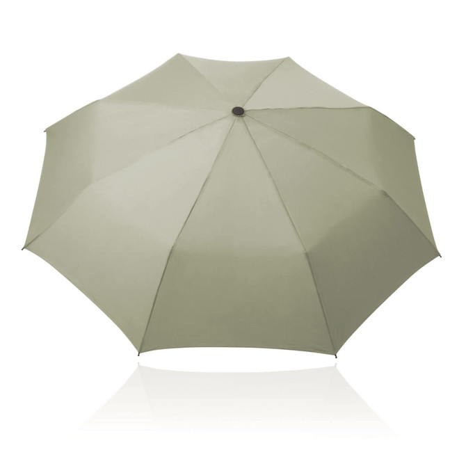 A folding umbrella in a muted green shade, featuring a central hub and a slightly reflective surface. It has a logo.