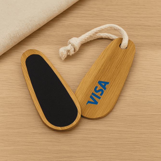 A bamboo paddle nail file featuring a black filing surface and a rope loop, with a logo on one side.