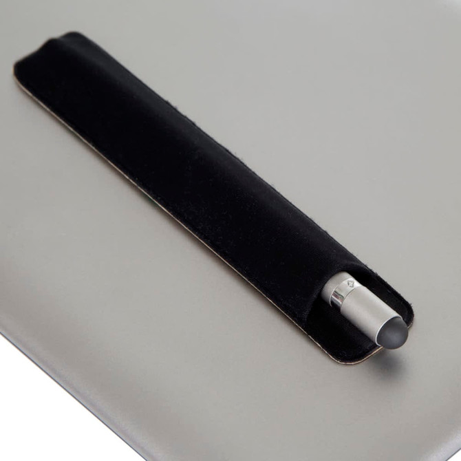 A metal pen with a silver tip, resting in a black leather holder on a grey surface. The image features branding.