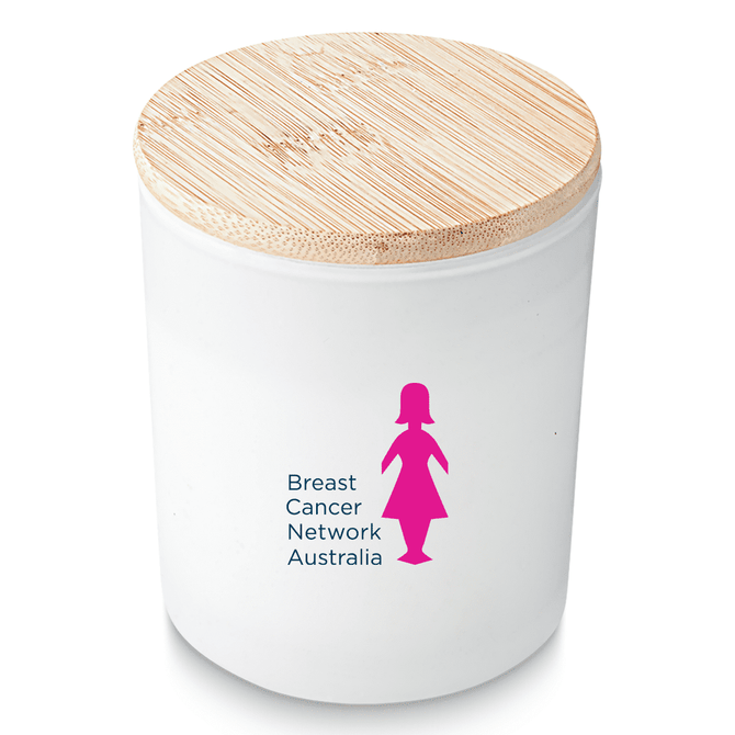 A medium white candle with a bamboo lid and a logo on the front.