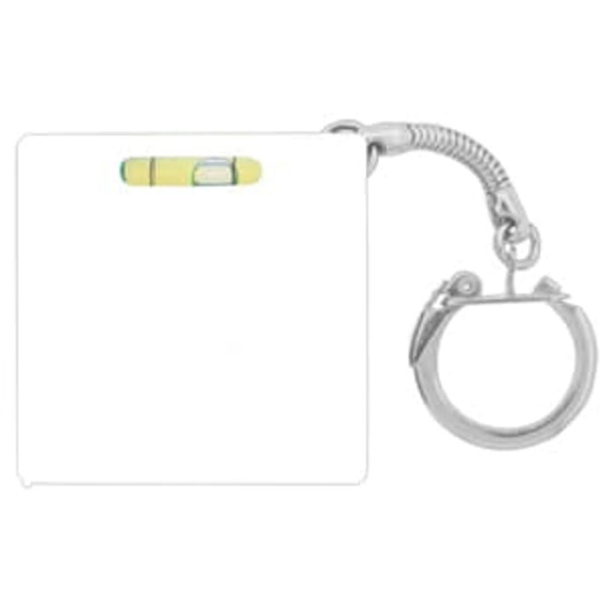 A silver keychain featuring a compact tape measure with a built-in level, primarily in yellow and white.