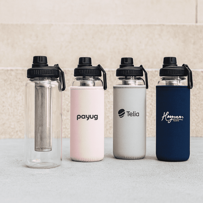 A drink bottle set featuring a clear bottle and three coloured bottles in pink, grey, and navy with branded designs.