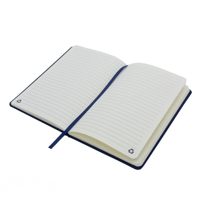 An A5 notebook with a navy blue cover, featuring blank lined pages and a ribbon bookmark. It has a logo on the inside.