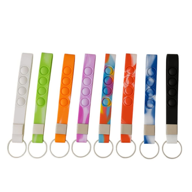 A collection of colourful popper stress reliever keychains in various shades, each with a keyring attachment.