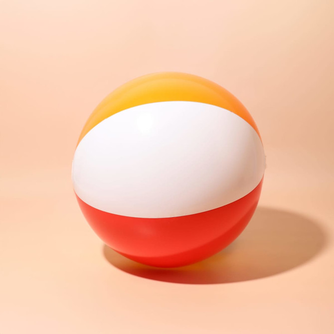 A beach ball featuring orange, white, and red panels, with a smooth, glossy surface and a logo.