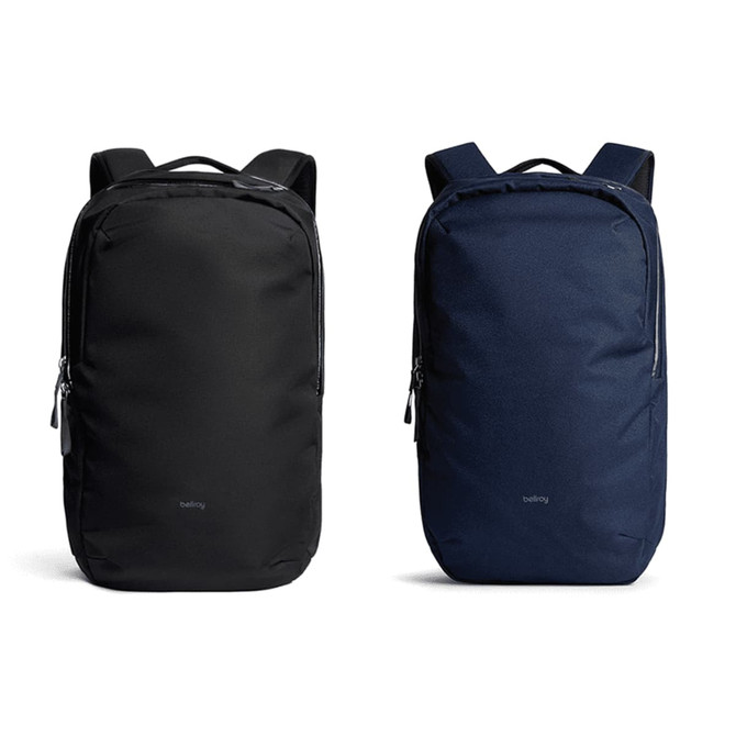 A black and a navy blue Bellroy Via Backpack 20L displayed side by side, featuring a logo and a sleek design.