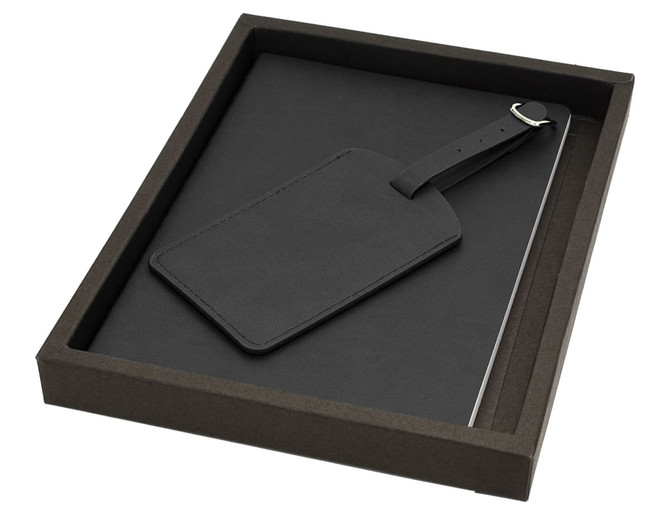 A black notebook set with a matching luggage tag, packaged in a dark box.
