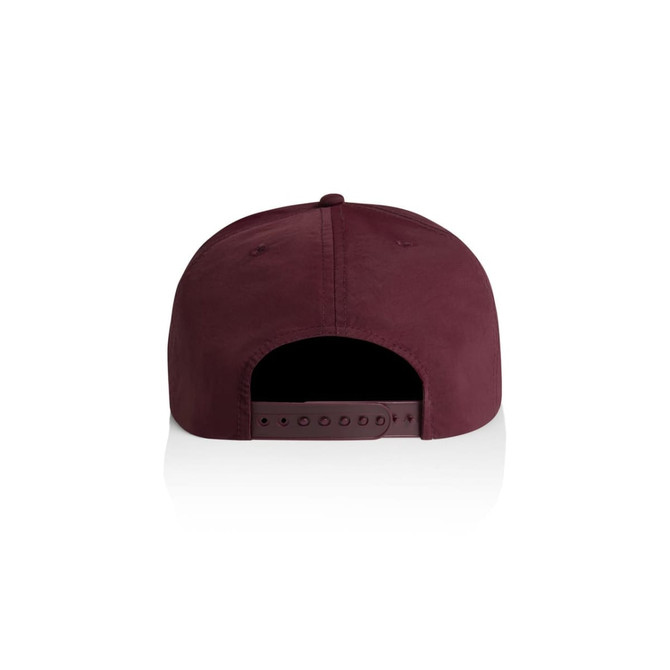A maroon cap featuring a solid fabric design and an adjustable strap at the back. Includes branding on the side.